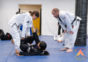 Jiu Jitsu coach watching over training in regina