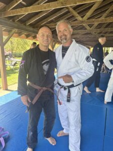 Older adult training Brazilian Jiu Jitsu in Rockford IL demonstrating control and efficiency