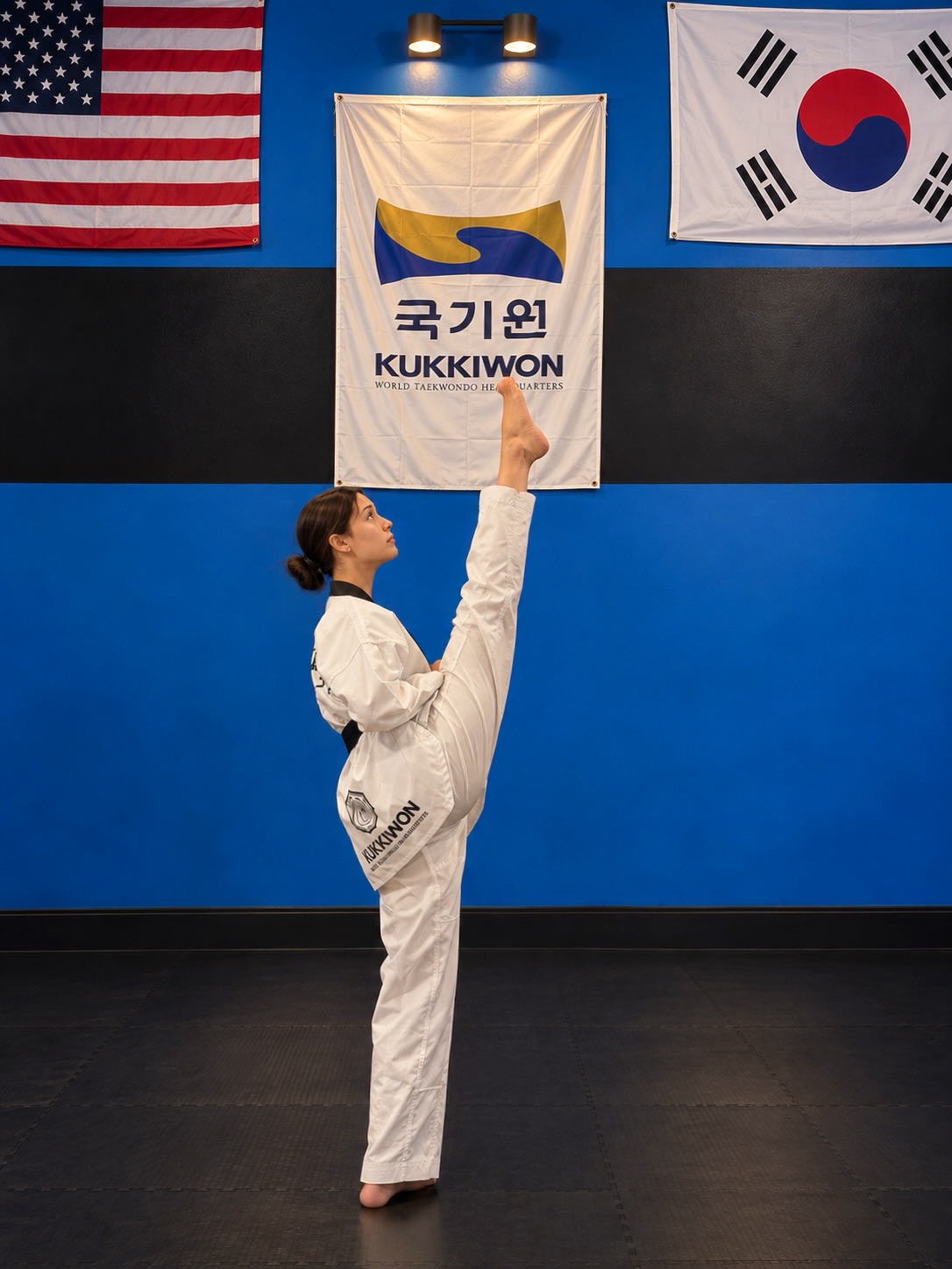 Taekwondo student demonstrating a high kick at Freedom Martial Arts