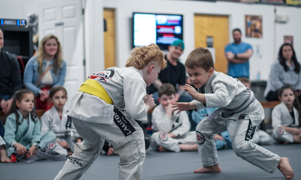 Two Lauzon MMA students training on the mats.