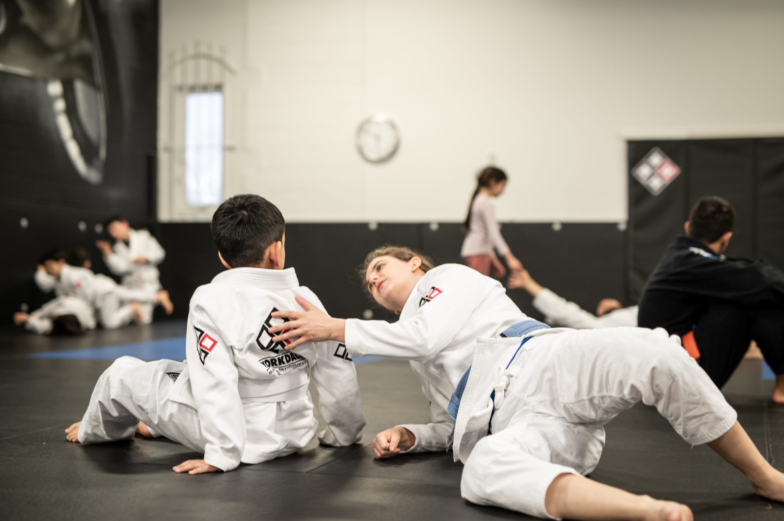 Teenage Yorkdale Martial Arts BJJ students supporting each other during drills.